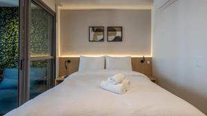 Cama ou camas em um quarto em 360 Ambience Vila Mariana