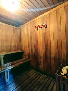a room with a wooden wall with a bench in it at Pousada dos Chalés - Araras in Araras Petropolis +62 photos