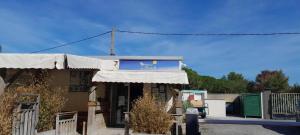 a building with a sign on the front of it at mobilcapagde in Le Grau-dʼAgde