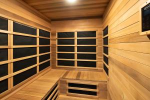 a sauna with wooden walls and wooden shelves at Updated Downtown home next to NAU in Flagstaff