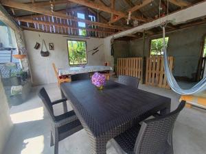 a dining room with a table and some chairs at Vera's Home in Anaklia