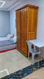 Postel nebo postele na pokoji v ubytování Aziz House 1