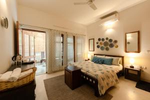a bedroom with a bed and a window at Art KOTHI Gurgaon in Gurgaon