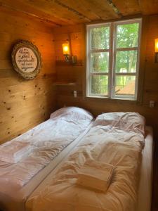 a large bed in a room with a window at Klondike City in Vojens