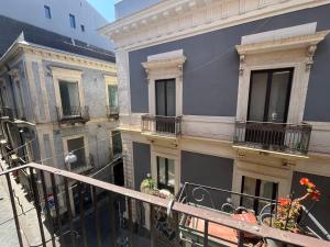 a view of a building from a balcony at La Torre in Catania