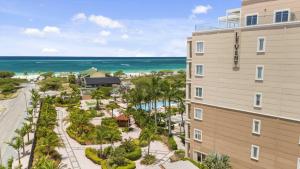 an apartment building with a view of the ocean at Eagle Beach - Luxury Beachscape 2BR condo - LV302 in Palm-Eagle Beach
