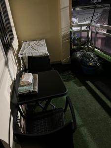 a room with a table and a chair and a bed at Residence Madison in Abidjan