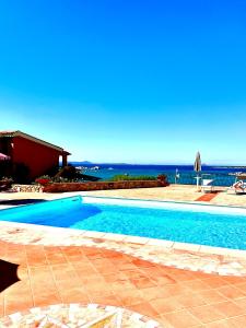 a swimming pool with a view of the ocean at Studio In The Gulf of Marinella in Marinella +19 photos