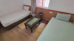 Postel nebo postele na pokoji v ubytování FAKHARA Hostel
