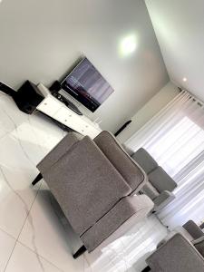 TV a/nebo společenská místnost v ubytování Prime nest properties