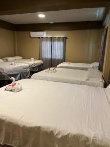 Postel nebo postele na pokoji v ubytování Enjoy Hotel