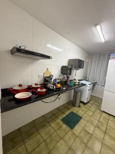 Η κουζίνα ή μικρή κουζίνα στο Quarto aconchegante e silencioso centro