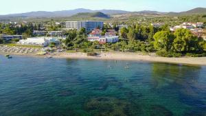 an aerial view of a beach with people in the water at Afroditi Beach in Gerakini