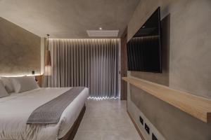 Kuuna Luxury Stays by Wynwood House 객실 침대