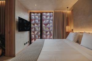 Kuuna Luxury Stays by Wynwood House 객실 침대