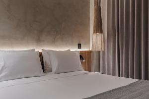 Kuuna Luxury Stays by Wynwood House 객실 침대