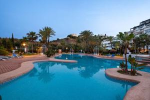 a swimming pool with blue water in a resort at Heavenly Homes Mojcar 93 in Mojácar
