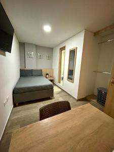 Postel nebo postele na pokoji v ubytování Hostelfc Teusaquillo