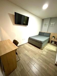 TV a/nebo společenská místnost v ubytování Hostelfc Teusaquillo