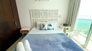 Postel nebo postele na pokoji v ubytování Magico Apartamento Frente al Mar 3 Habitaciones MSC64