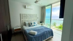 Postel nebo postele na pokoji v ubytování Magico Apartamento Frente al Mar 3 Habitaciones MSC64