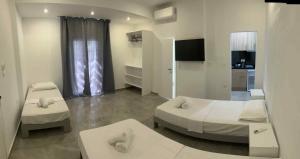 a hospital room with two beds and a mirror at SALOU on the Beach in Ipsos