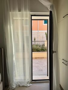 a sliding glass door with a view of a patio at Lulu Lustica bay in Tivat +14 photos
