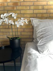 Ένα ή περισσότερα κρεβάτια σε δωμάτιο στο MOVE Eco Health Hotel