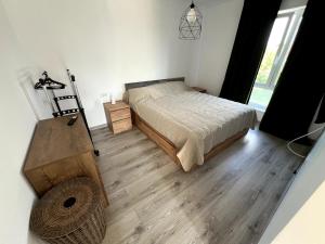 Postel nebo postele na pokoji v ubytování Tâmpa Cozy Hideaway
