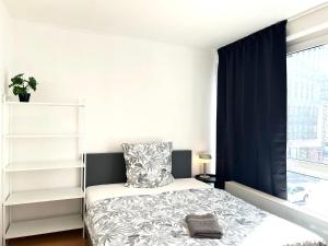 Ein Bett oder Betten in einem Zimmer der Unterkunft VIKTORIA RESIDENCE
