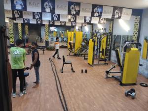 a group of people standing in a gym at hotel delight town by 03 in Agra +8 photos