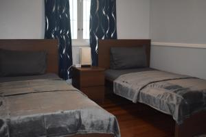 Ліжко або ліжка в номері Villa Blue Vue