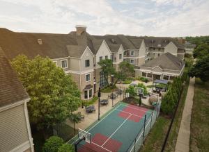 an aerial view of a house with a tennis court at Staybridge Suites Peoria Downtown by IHG in Peoria