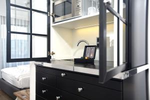 a bedroom with a sink and a mirror at Das Windhuk in Westerland (Sylt) +39 photos