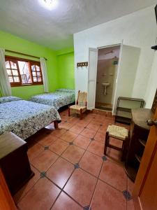 Postel nebo postele na pokoji v ubytování Hospedaje Teponaztle
