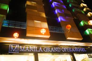 a building with a sign that reads nandanandan grand opening at Manila Grand Opera Hotel in Manila