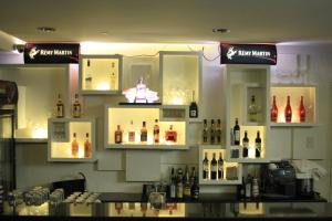 a bar with bottles of alcohol on the wall at Manila Grand Opera Hotel in Manila