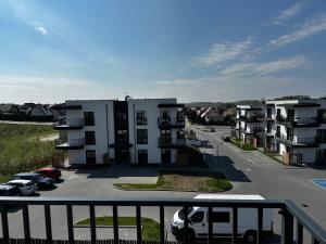 arial view of a parking lot with apartment buildings at Apartament Aleja Poetów in Chojnice