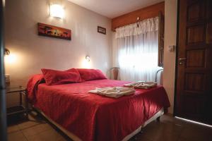 Postel nebo postele na pokoji v ubytování Hotel Carlos Paz