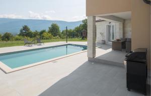 a swimming pool in front of a house at Amazing Home In Krsan in Kršan +30 photos