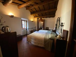 a bedroom with a large bed in a building at Casa Maga in Vallo di Nera