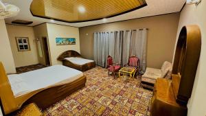 Highland Club Balakot客房内的一张或多张床位