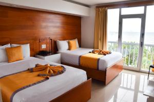 Postel nebo postele na pokoji v ubytování Napolitano Hotel