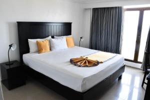 Postel nebo postele na pokoji v ubytování Napolitano Hotel
