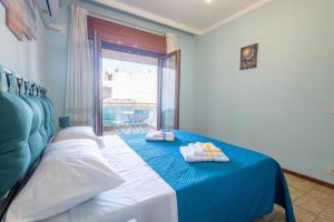 Ένα ή περισσότερα κρεβάτια σε δωμάτιο στο Sole e Luna Apartment