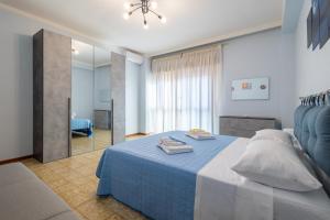 Ένα ή περισσότερα κρεβάτια σε δωμάτιο στο Sole e Luna Apartment