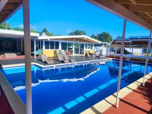 a house with a swimming pool and a house at Beachwood Condos & Resort in Copalis Beach