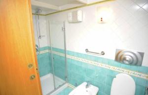 a bathroom with a shower and a toilet and a sink at Il Sogno Italiano in Atrani +10 photos