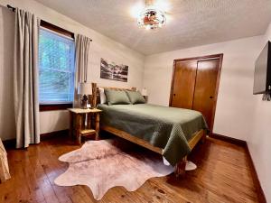 a bedroom with a bed and a window at Mill Haus in South Bloomingville