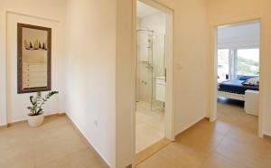 a room with a bathroom with a shower and a mirror at MaMi in Korčula +64 photos